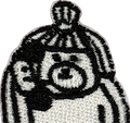 Black and white embroidered bear wearing pom pom winter hat and scarf