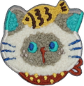 Flurry Siamese Cat with Fish on Head