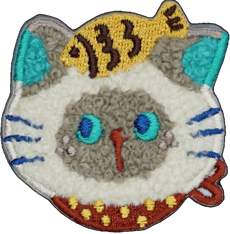 Flurry Siamese Cat with Fish on Head